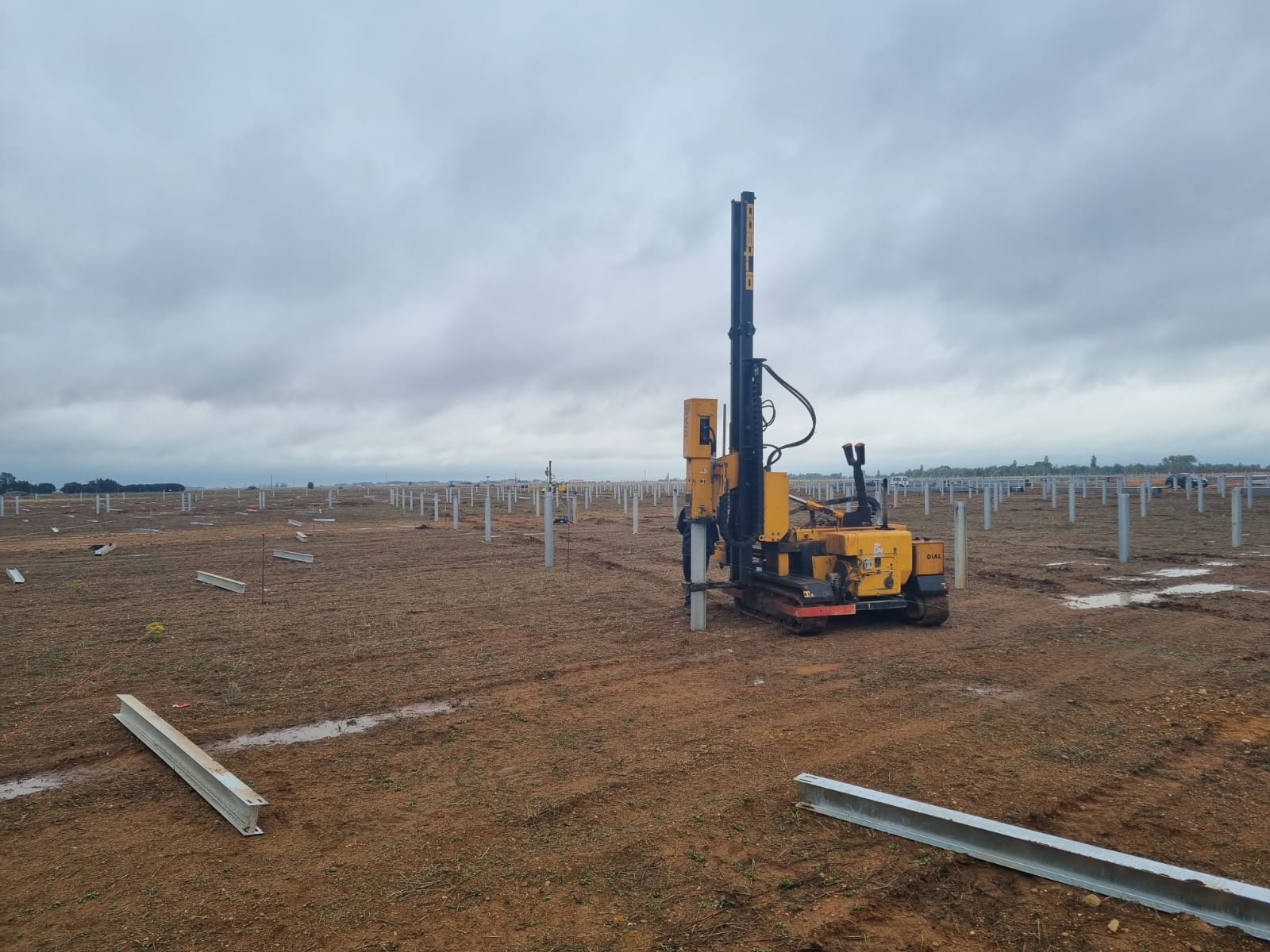 Solar PV steel pile installation across a utility-scale project site in East Africa